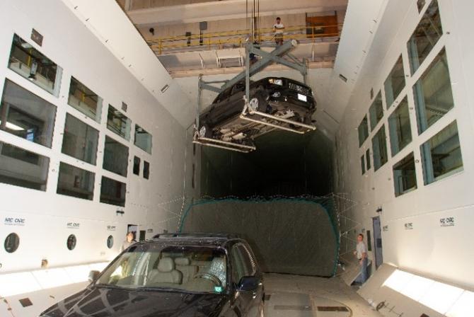 Two trucks being tested in the wind tunnel