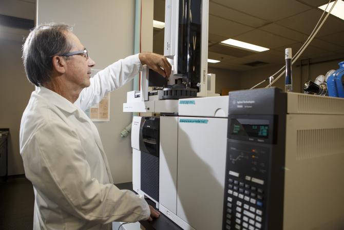 Researcher uses equipment in a lab