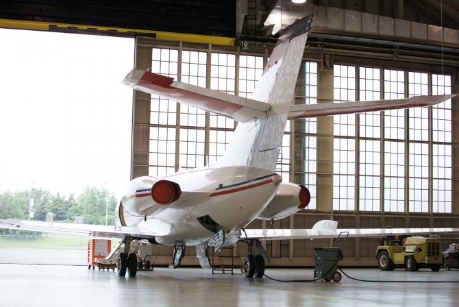 An aircraft about to exit the hangar