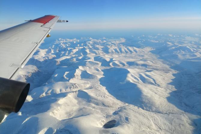 View from the aircraft, looking over Arctic terrain