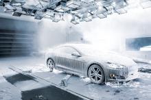 Car covered in ice and snow in a test chamber