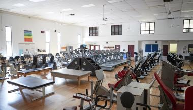Gym with a full variety of physical training equipment.